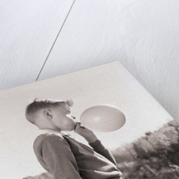 Boy Blowing a Balloon by Anonymous