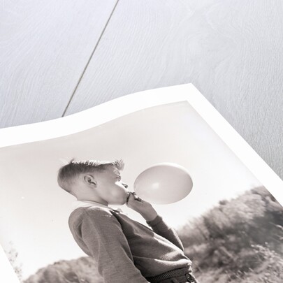 Boy Blowing a Balloon by Anonymous