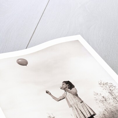 Girl Holding a Balloon by Anonymous