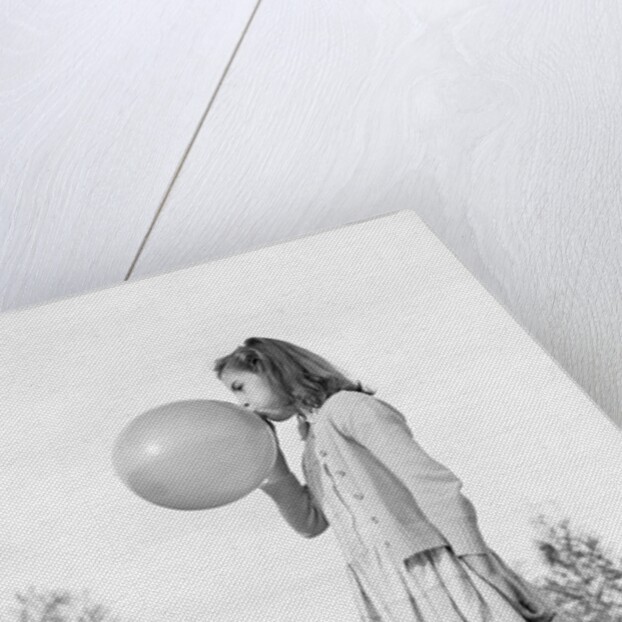 Girl Blowing a Balloon by Anonymous
