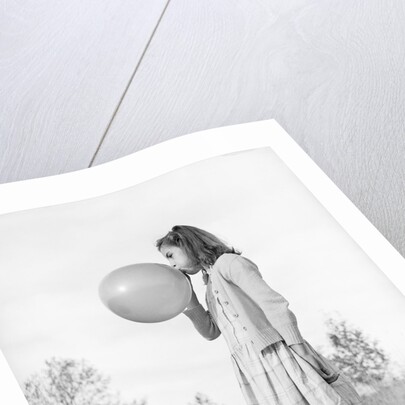 Girl Blowing a Balloon by Anonymous