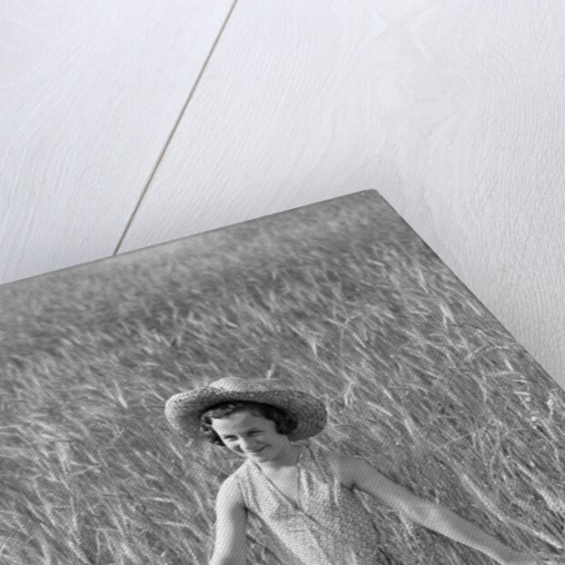 Girl Standing in Wheat Field by Anonymous