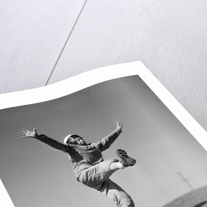 Boy Kicking a Football by Anonymous