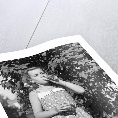 Girl Blowing Soap Bubbles by Anonymous