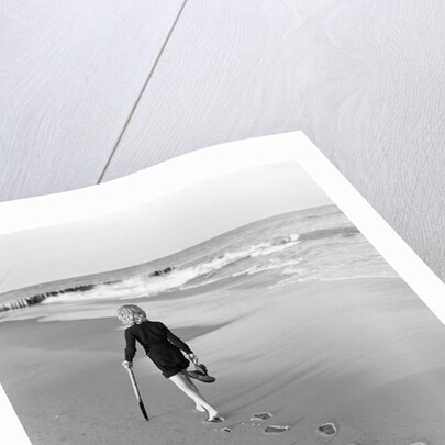 Woman Walking on Beach Leaving Footprints by Anonymous