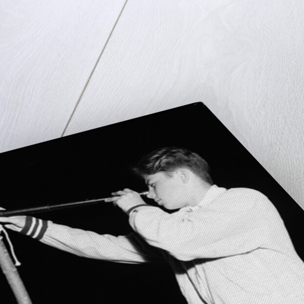 Boy Looking Through a Telescope by Anonymous