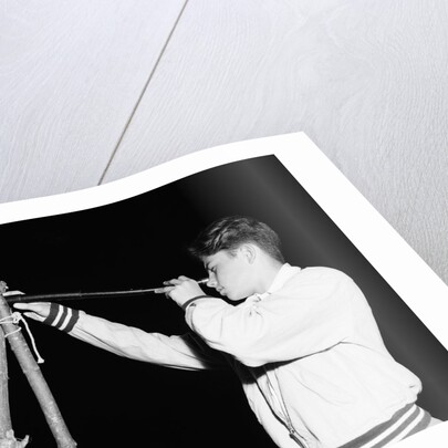 Boy Looking Through a Telescope by Anonymous