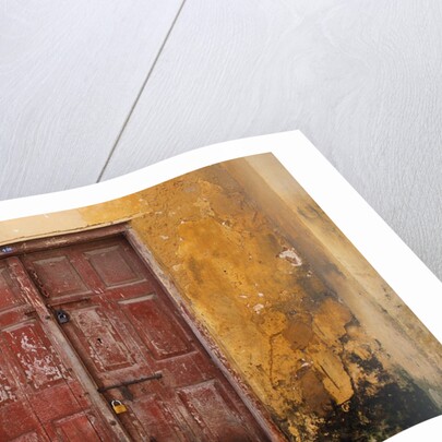 Wooden Door in Worn Wall by Anonymous