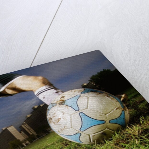 Soccer Player Kicking Ball by Anonymous
