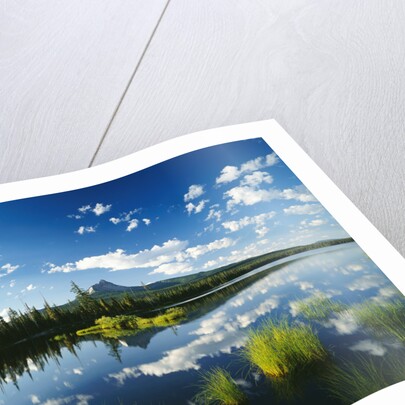 Clouds in Sky Reflected by Mountain Lake by Anonymous