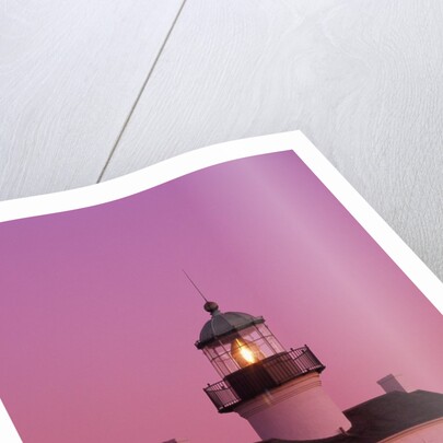 Lighthouse Against a Pink Sky at Twilight by Anonymous