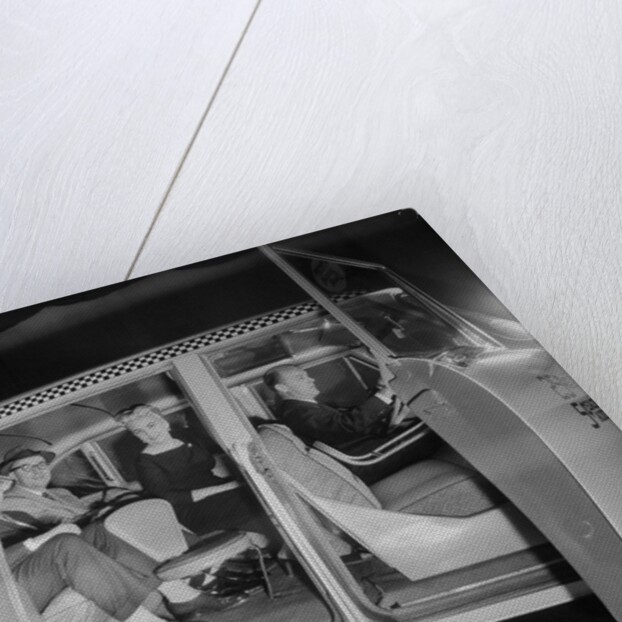 Interior View of Passengers Inside a New York City Checker Cab by Anonymous
