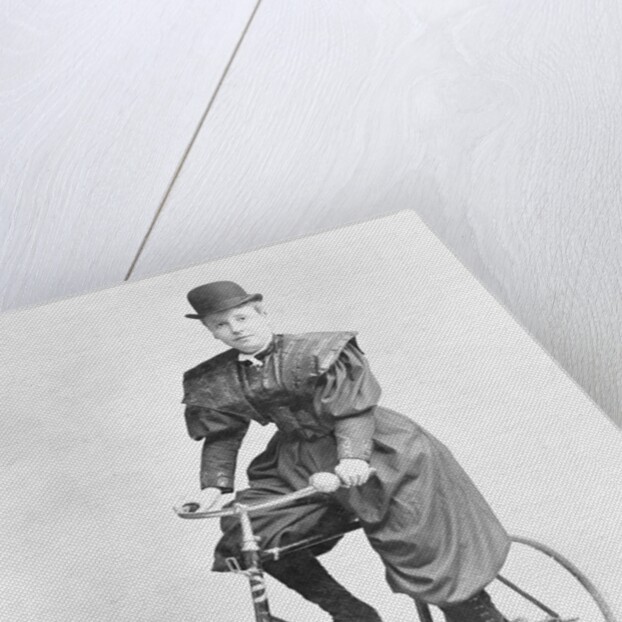Suffragette Dressed in Man's Hat on Bicycle by Anonymous