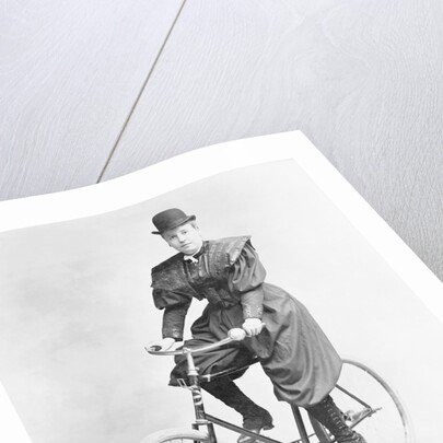 Suffragette Dressed in Man's Hat on Bicycle by Anonymous