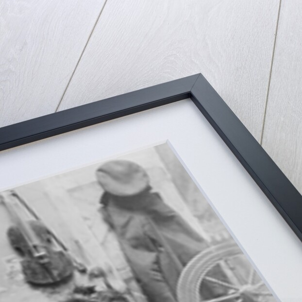 Shoemaker Preparing Shoes for Young Boy by Anonymous