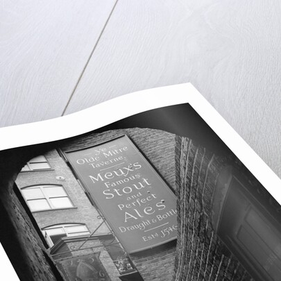 Man Outside Ye Olde Mitre Tavern by Corbis