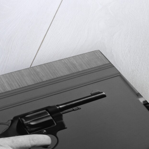 Hand Holding Colt .38 Special Revolver by Anonymous