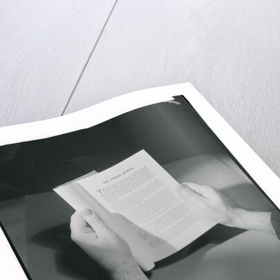 Hands Holding Open Booklet by Anonymous