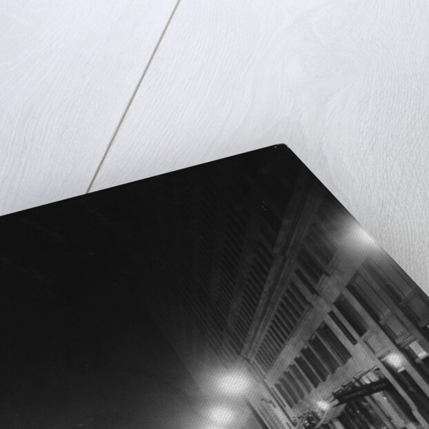 Street Lights Along a Cobblestone Street by Anonymous