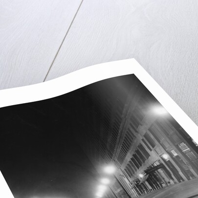 Street Lights Along a Cobblestone Street by Anonymous