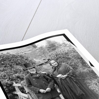 Elderly Couple Standing by Fence by Anonymous