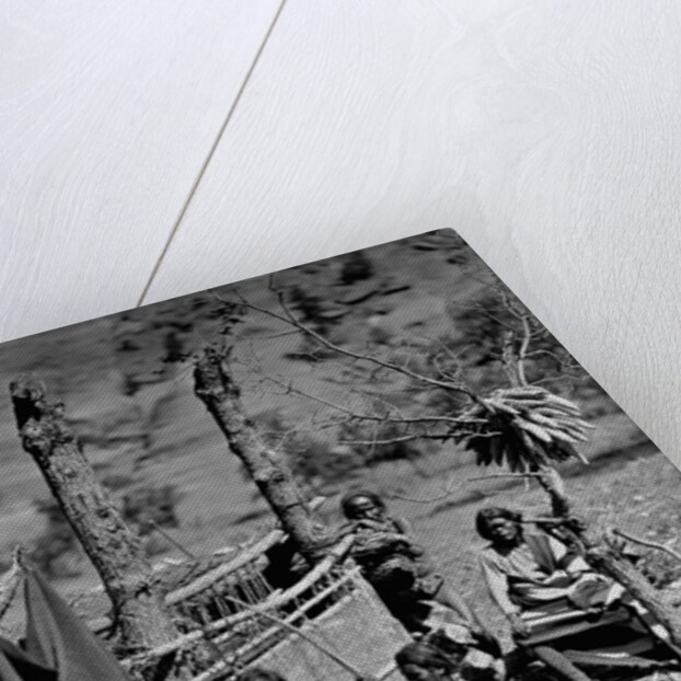 A Navajo Family Outside Their Home by Anonymous