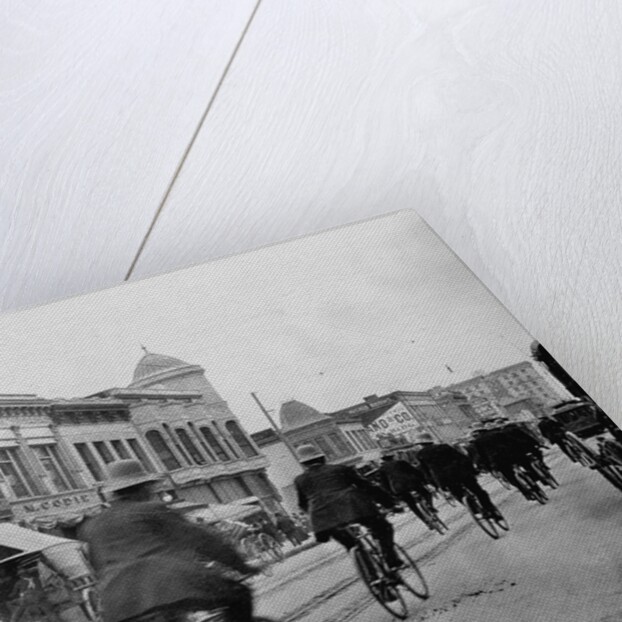 Los Angeles Police Officers Bicycling Past Broadway Storefronts by Anonymous