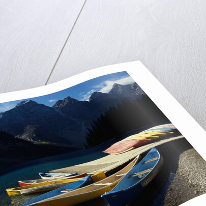 Canoes at Moraine Lake in Banff by Anonymous