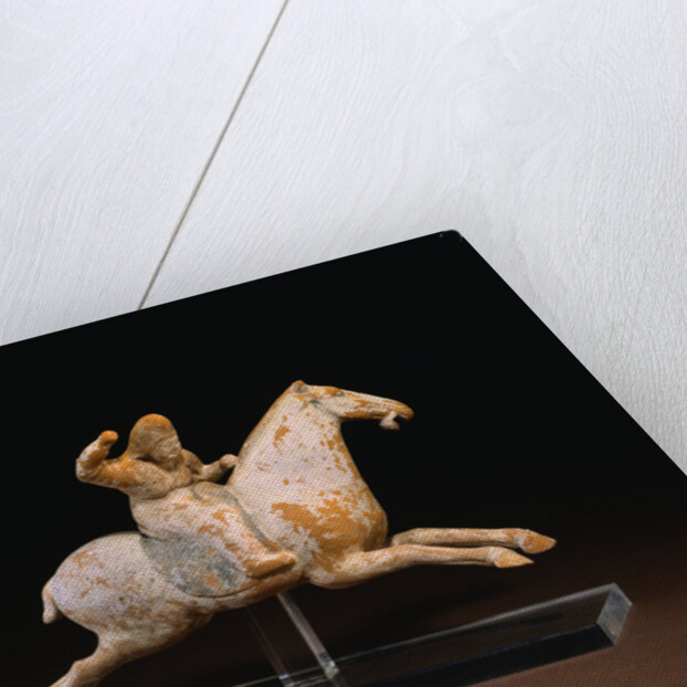 A Rare Painted Pottery Figure of a Female Polo Player by Anonymous