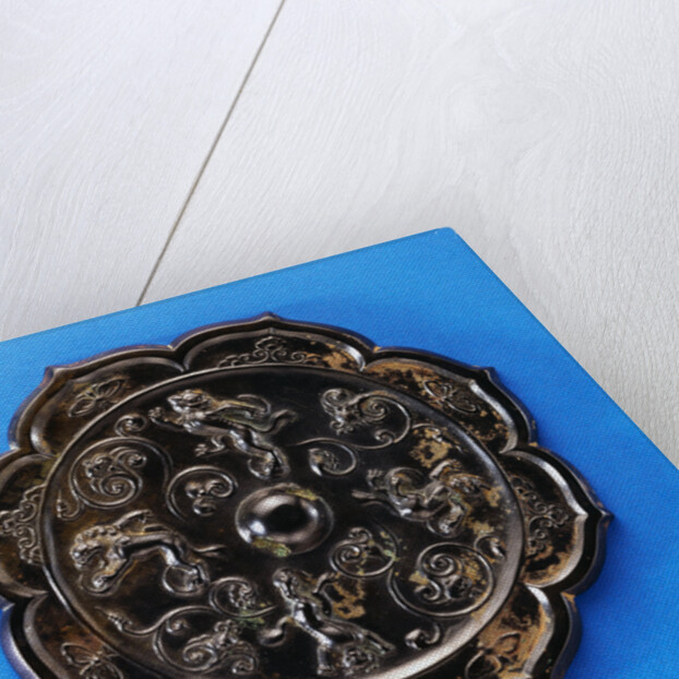 A Well-Cast Foliate Bronze Mirror. Tang Dynasty by Anonymous