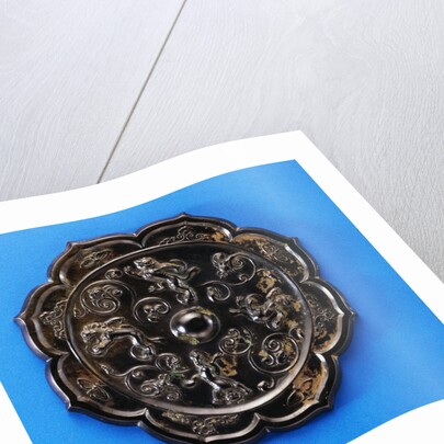 A Well-Cast Foliate Bronze Mirror. Tang Dynasty by Anonymous