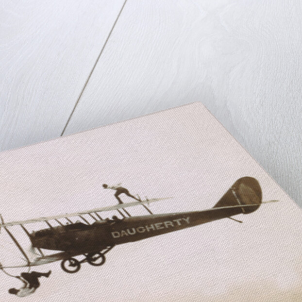 Photograph of a Wingwalkers on a Biplane by Anonymous