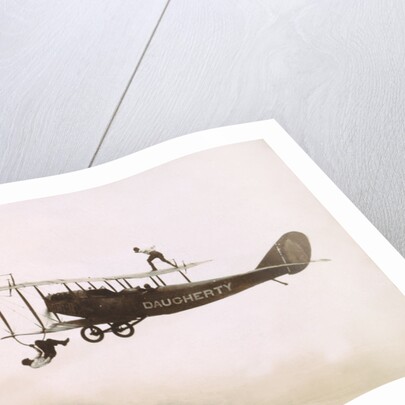 Photograph of a Wingwalkers on a Biplane by Anonymous