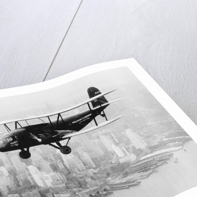 Airplane Flying Near Manhattan by Anonymous