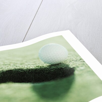 Golf Ball on the Edge of the Hole by Anonymous