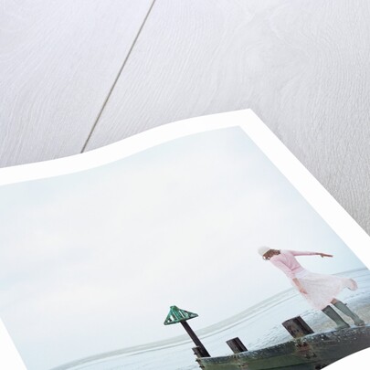 Woman Balancing on a Breakwater by Anonymous