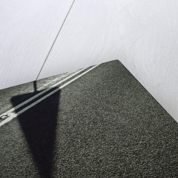 Shadow of Sign on Road by Anonymous