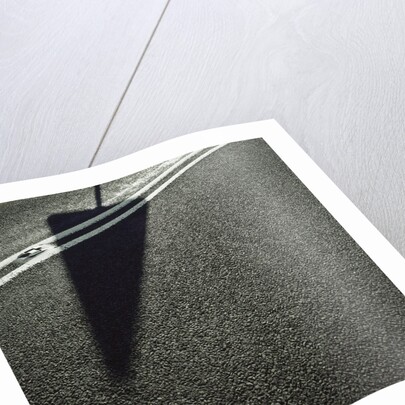 Shadow of Sign on Road by Anonymous