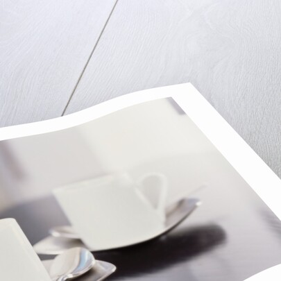 Two coffee cups on a table by Anonymous