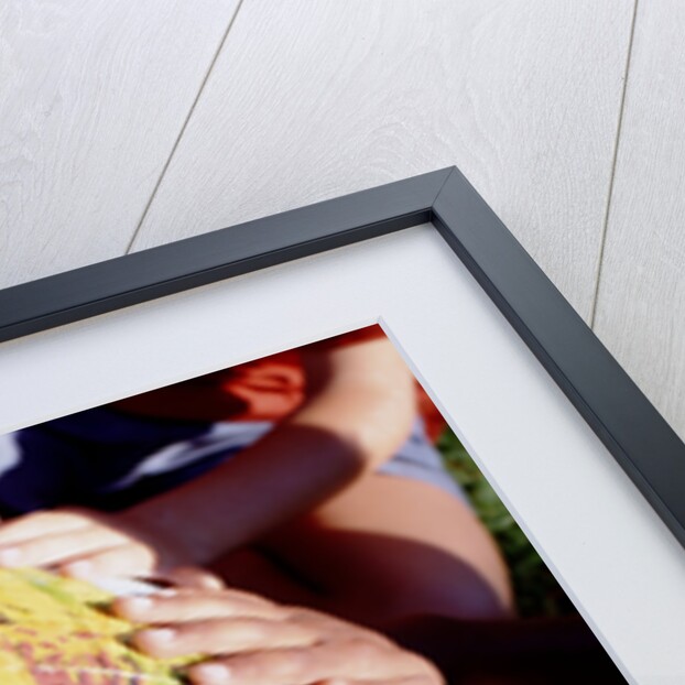 Children's Hands on Inflatable Globe by Anonymous