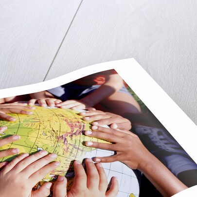 Children's Hands on Inflatable Globe by Anonymous