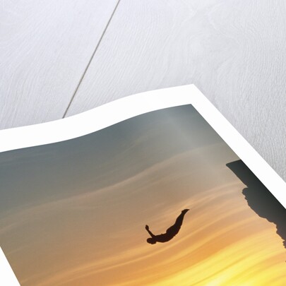 Cliff Diver Above Setting Sun by Anonymous