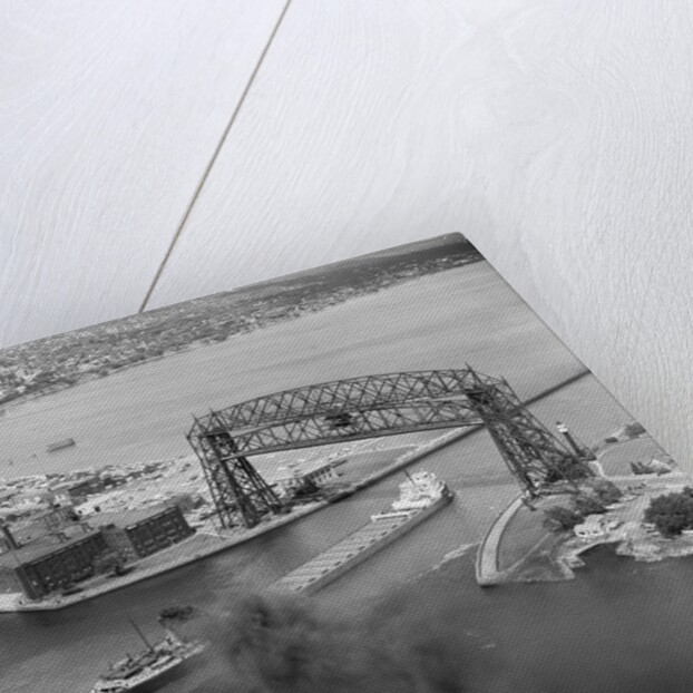 Cargo Boat Passing Under Bridge by Anonymous