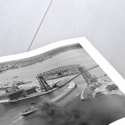 Cargo Boat Passing Under Bridge by Anonymous
