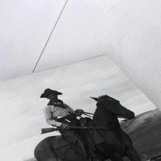 Cowboy on Horseback with Rifle by Anonymous