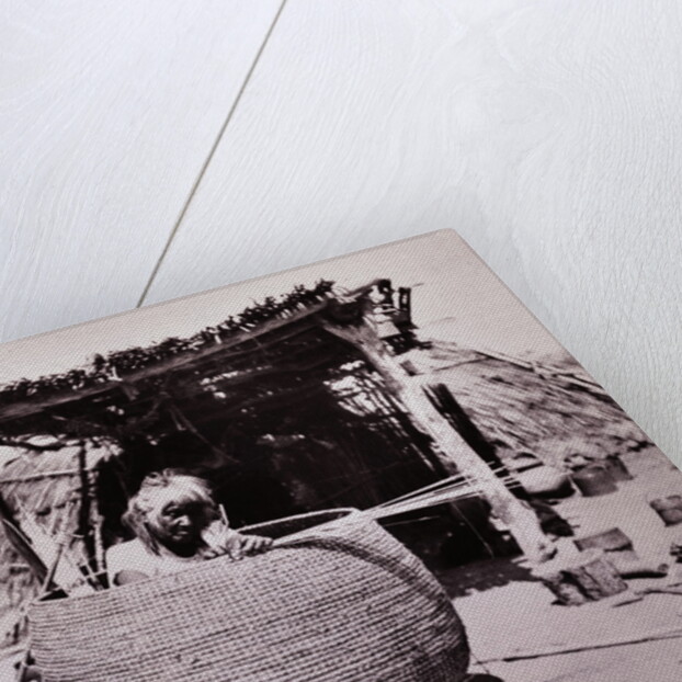 Woman Weaving Basket by Anonymous