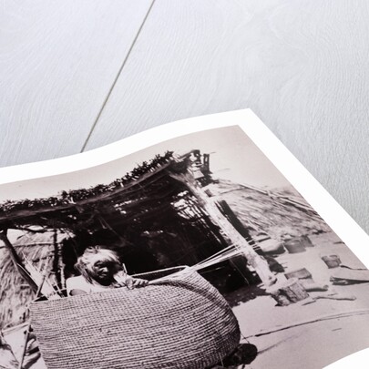 Woman Weaving Basket by Anonymous