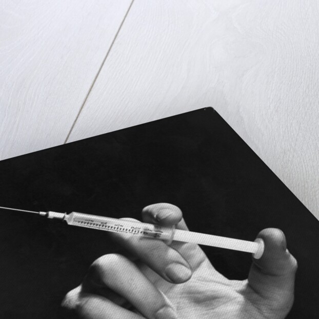 Hand Holding Syringe by Anonymous