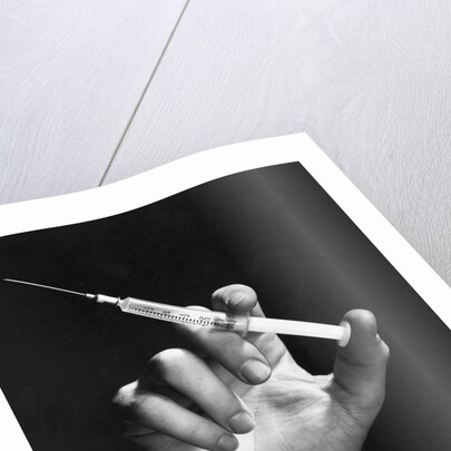 Hand Holding Syringe by Anonymous