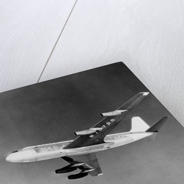 Large Aircraft Flying over Mountainous Region by Anonymous